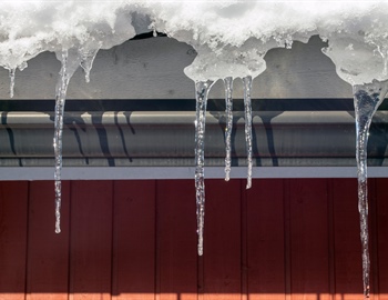 Can Professional Gutter Cleaning Prevent Ice Dams & Water Damage?