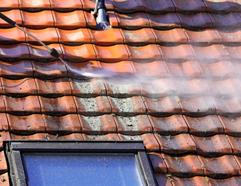 How Exterior Buildup Shortens the Lifespan of Siding, Roofing, and Concrete