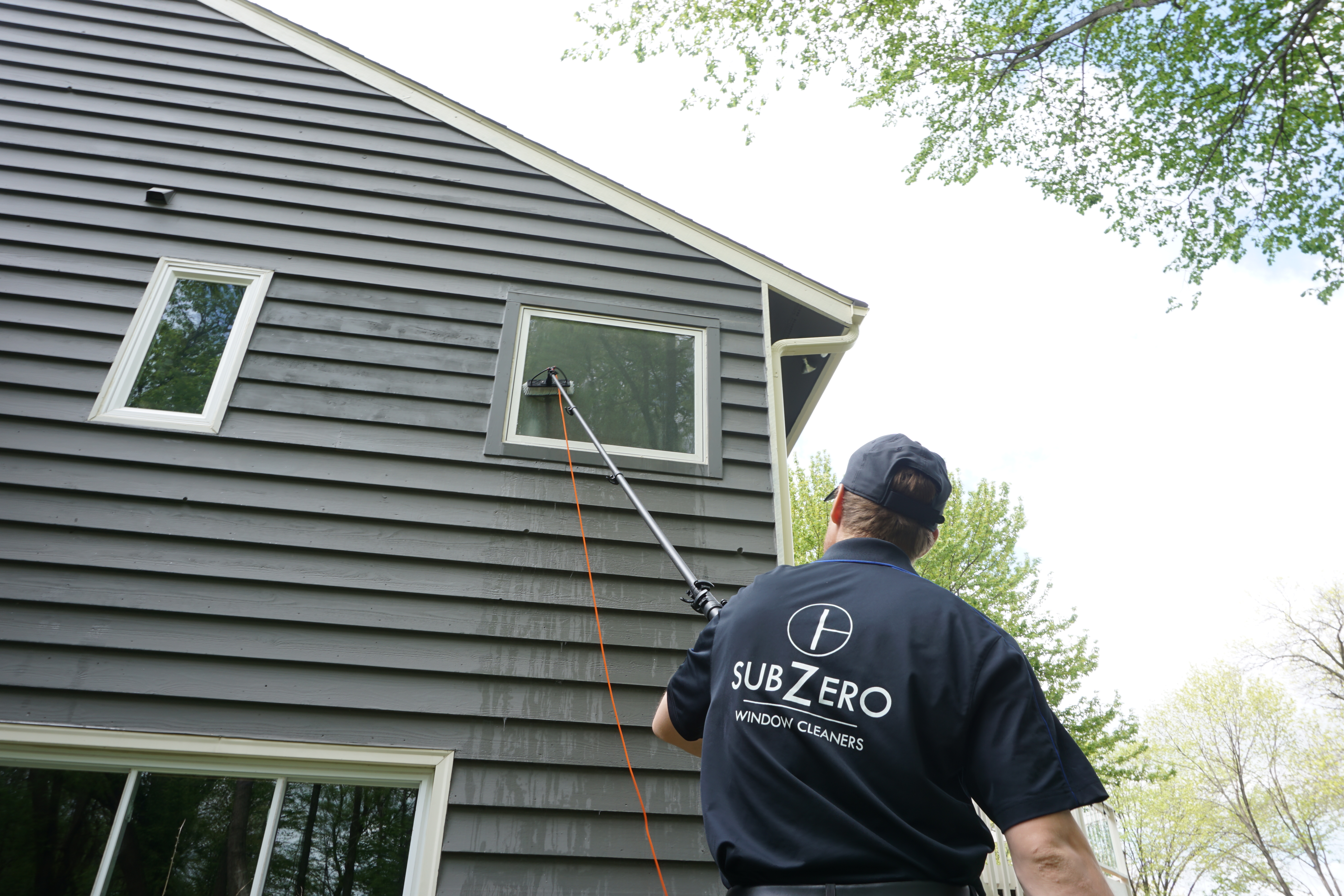 Sub Zero Cleaning Exterior Windows of a house